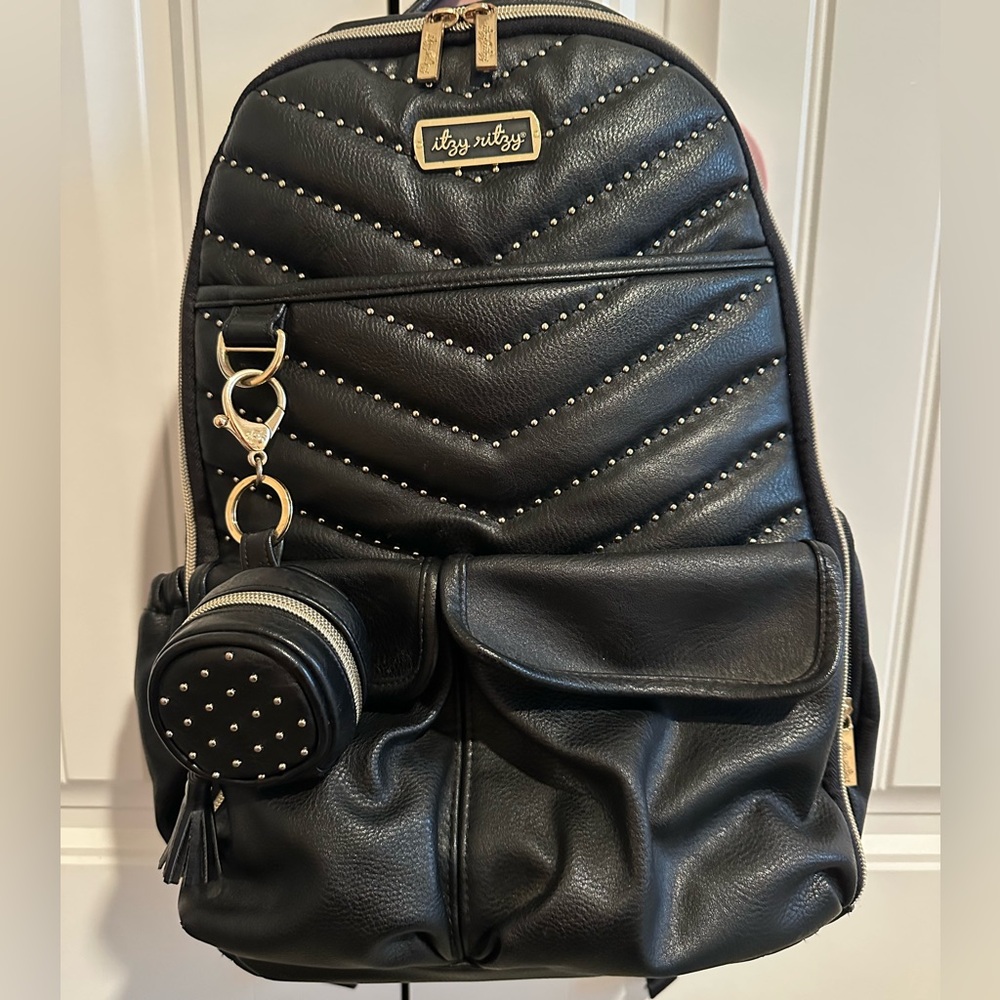 Itzy Ritzy Rock and Roll Boss Diaper Bag. Gold studded with paci holder
